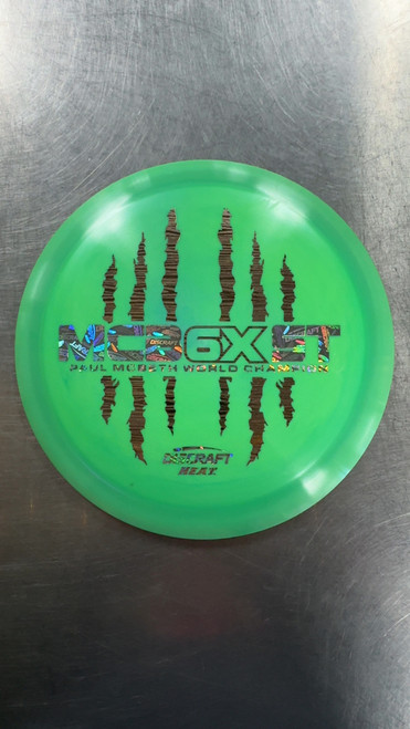 Vist Large View of Product Image Which is Used Discraft ESP MCBETH 6X CLAW HEAT Disc Golf Driver Green