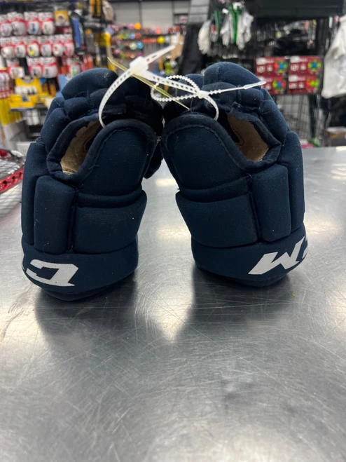 Vist Large View of Product Image Which is Used CCM 4R Junior Gloves Navy Blue 10"