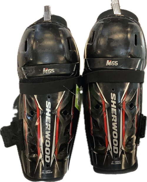 Vist Large View of Product Image Which is Used Sher-wood M65 Junior Shin Guards Black 11"