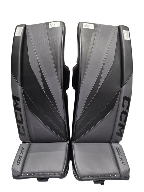 Vist Large View of Product Image Which is CCM AXIS XF Goalie Leg Pads Senior Black/Grey 34+1”