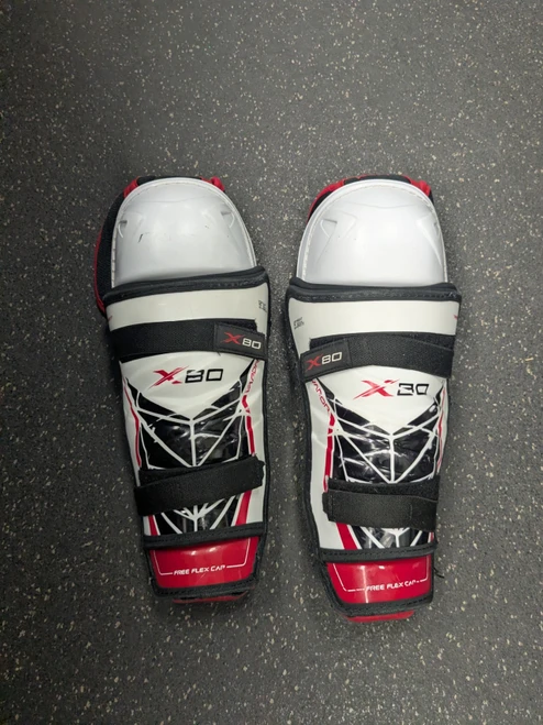 Vist Large View of Product Image Which is Used Bauer X80 Junior Shin Guards White 12"