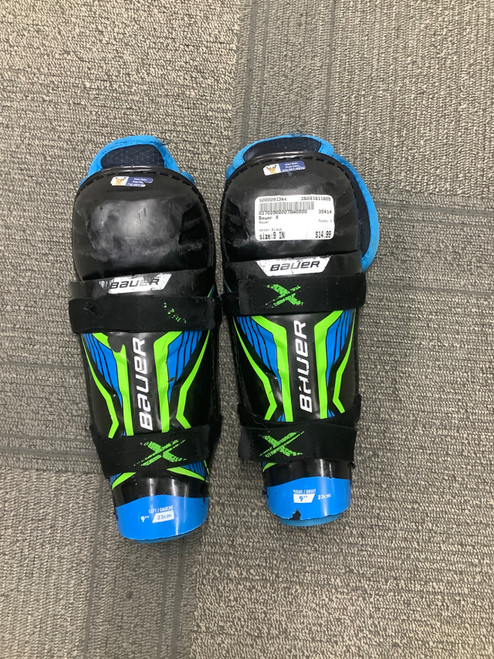 Vist Large View of Product Image Which is Used Bauer X Junior Shin Guards Black 9"
