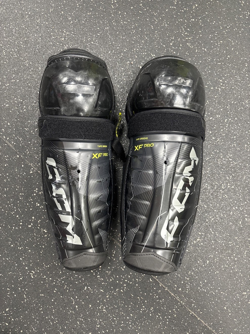 Vist Large View of Product Image Which is Used CCM TACKS XF PRO Senior Shin Guards Black 13"