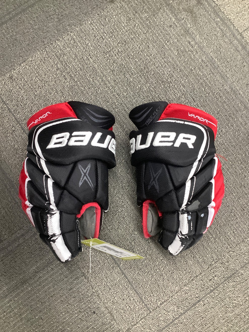 Vist Large View of Product Image Which is Used Bauer VAPOR X SHIFT PRO Intermediate Gloves Red 12"