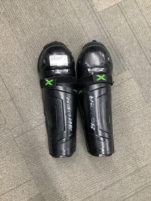 Vist Large View of Product Image Which is Used Bauer X SHIN Junior Shin Guards Black 12"