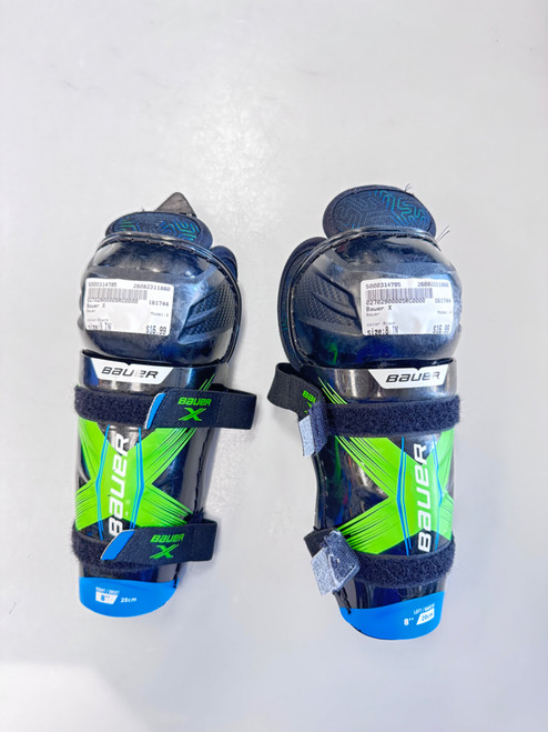 Vist Large View of Product Image Which is Used Bauer X Youth Shin Guards Black 8"