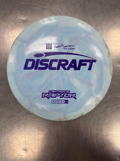 Vist Large View of Product Image Which is Used Discraft CAPTAINS RAPTOR ULIBARRI Disc Golf Driver Carolina Blue