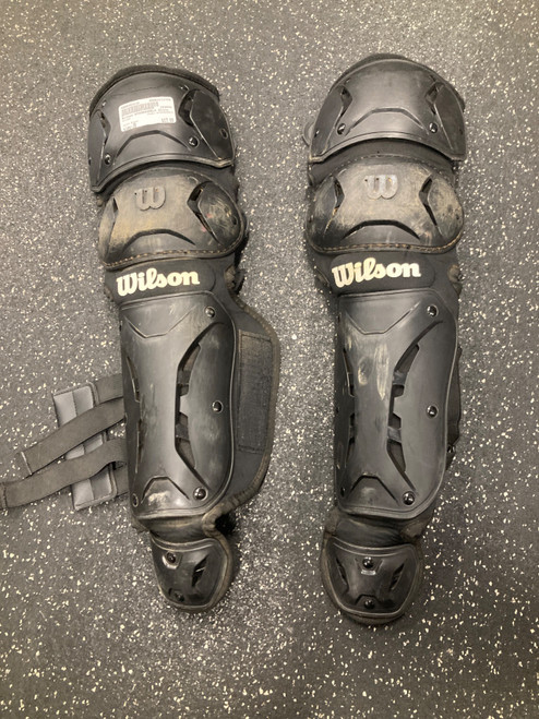 Vist Large View of Product Image Which is Used Wilson WTA368406LX Catchers Leg Guards Black Junior