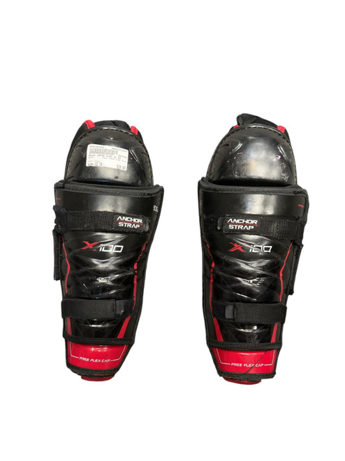 Vist Large View of Product Image Which is Used Bauer VAPOR X100 12 SG Junior Shin Guards Black 12"