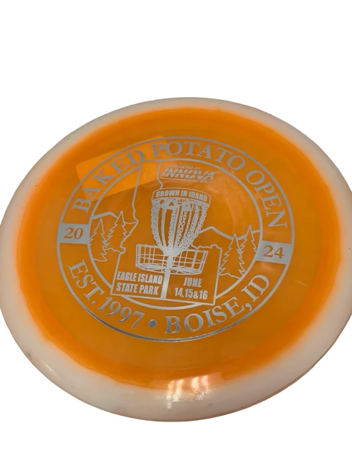 Vist Large View of Product Image Which is Used Innova Destroyer BAKED POTATO OPEN 2024 Eagle Island State Park Disc Golf Driver Orange 170g