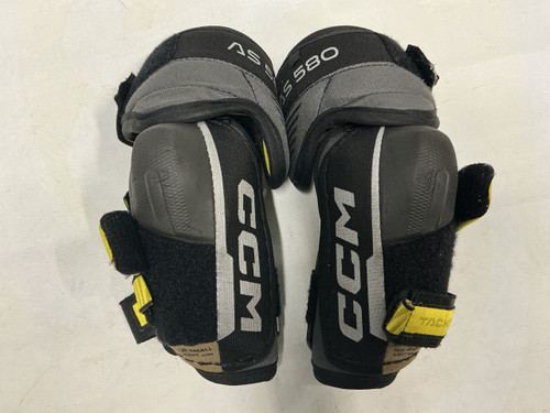 Vist Large View of Product Image Which is Used CCM TACKS AS580 Junior Elbow Pads Black And Optic Yellow SM