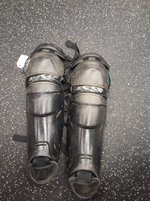 Vist Large View of Product Image Which is Used Easton X JEN Catchers Leg Guards Black Adult