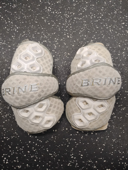 Vist Large View of Product Image Which is Used Brine TRIUMPH 2 Lacrosse Arm Pads/Guards White Senior