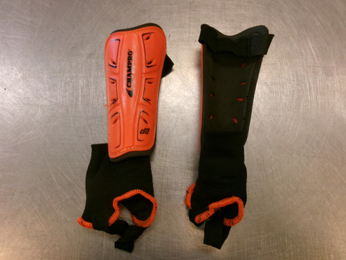 Vist Large View of Product Image Which is Used Champro Soccer Shin Guards Youth Orange LG