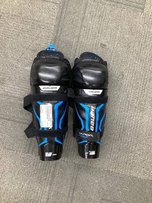 Vist Large View of Product Image Which is Used Bauer VOLT Youth Shin Guards Black 9"