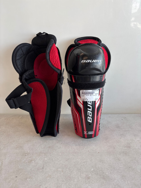 Vist Large View of Product Image Which is Used Bauer Youth Shin Guards Black 9"