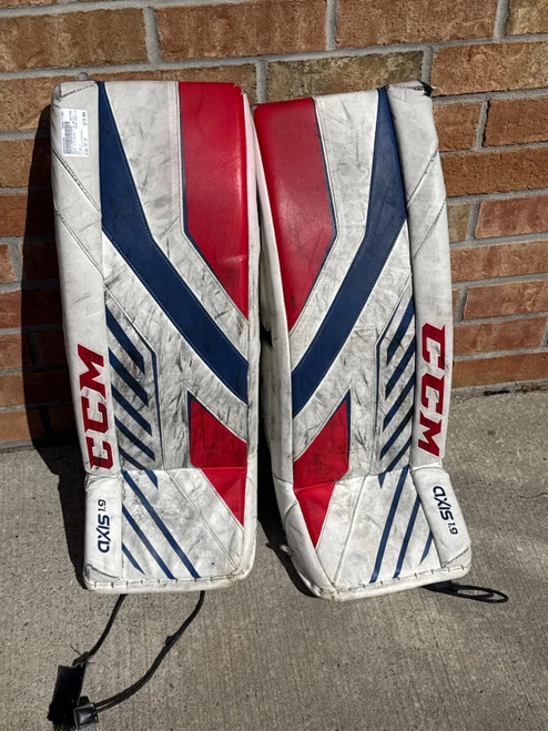 Vist Large View of Product Image Which is Used CCM AXIS 1.9 Goalie Leg Pads Junior White/Red/Navy 30"