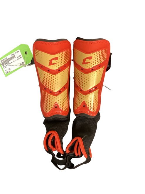Vist Large View of Product Image Which is Used Champro Soccer Shin Guards Youth Gold XXS