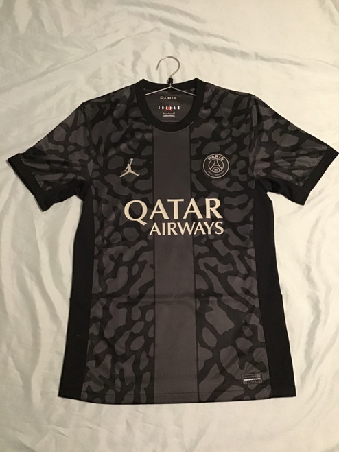Vist Large View of Product Image Which is NEW Nike PSG JERSEY Soccer Top Adt Black And Grey SM