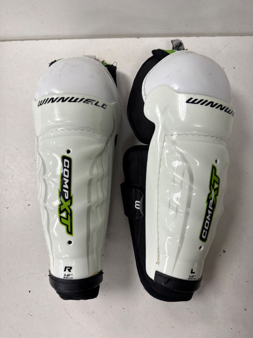 Vist Large View of Product Image Which is Used WinnWell COMPXT Intermediate Shin Guards White 12"