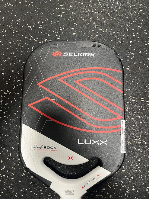 Vist Large View of Product Image Which is Used Selkirk LUXX Pickleball Racquet Black And White