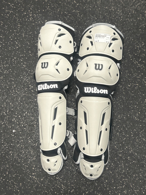 Vist Large View of Product Image Which is Used Wilson JGN Catchers Leg Guards Grey Junior