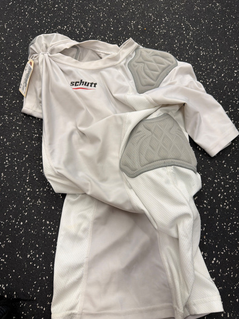 Vist Large View of Product Image Which is Used Schutt SHOULDER/RIB SHIRT FB Top Adult White SM