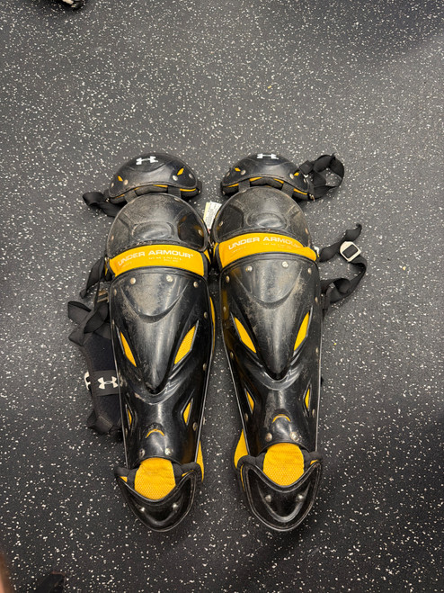 Vist Large View of Product Image Which is Used Under Armour UAWLG2-A Catchers Leg Guards Black Junior