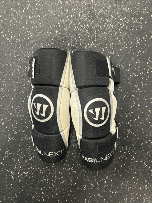Vist Large View of Product Image Which is Used Warrior RABIL NEXT ARM PADS YOUTH Lacrosse Arm Pads/Guards White XL
