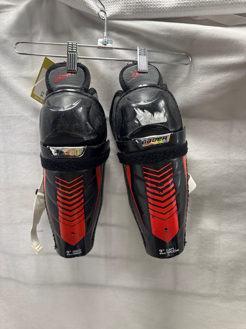 Vist Large View of Product Image Which is Used Bauer LIL SPORT Junior Shin Guards Black 9"