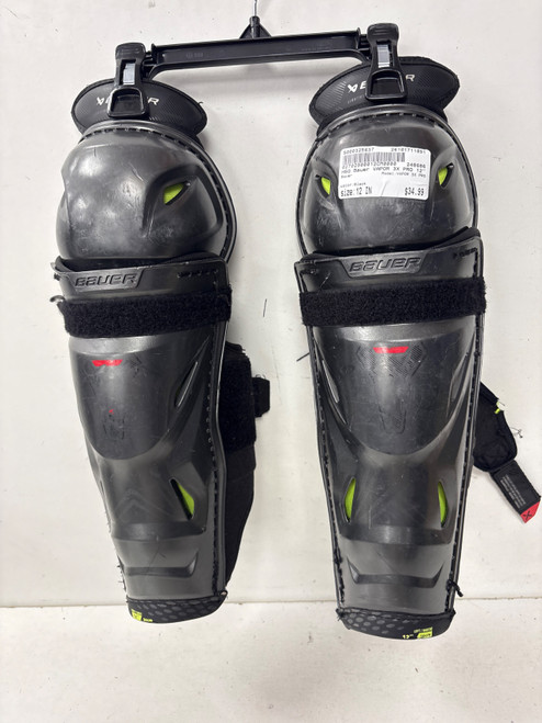 Vist Large View of Product Image Which is Used Bauer VAPOR 3X PRO Intermediate Shin Guards Black 12"