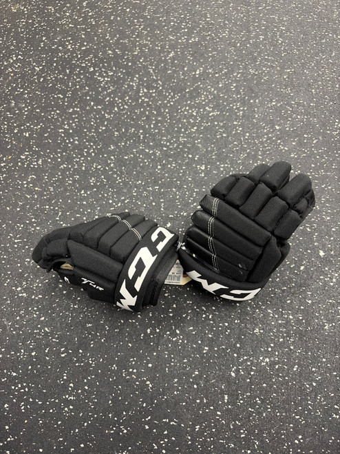 Vist Large View of Product Image Which is Used CCM 4R Youth Gloves Black 9"
