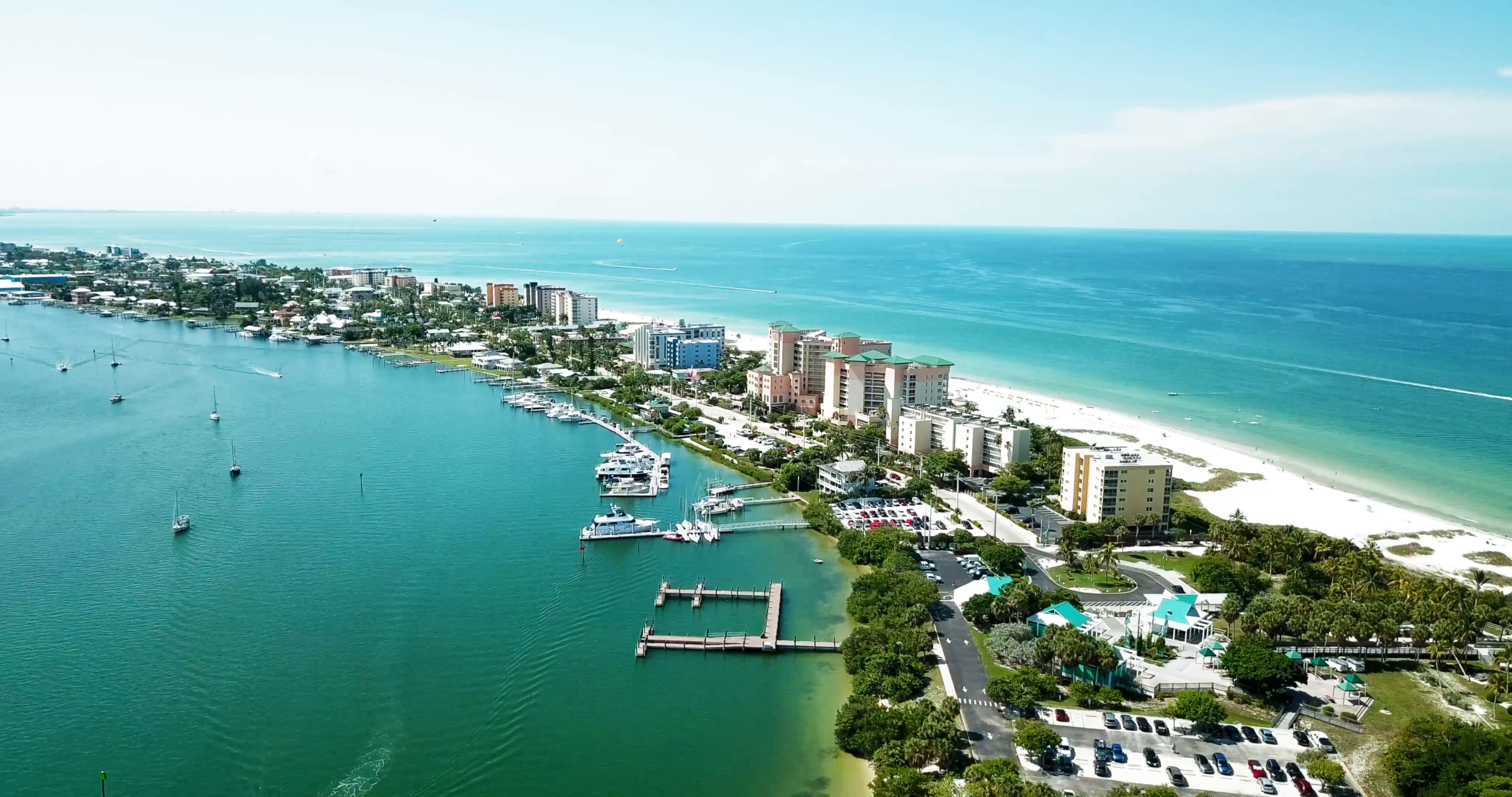 Aerial drone view of Fort Myers Beach shoreline with turquoise water and white sand