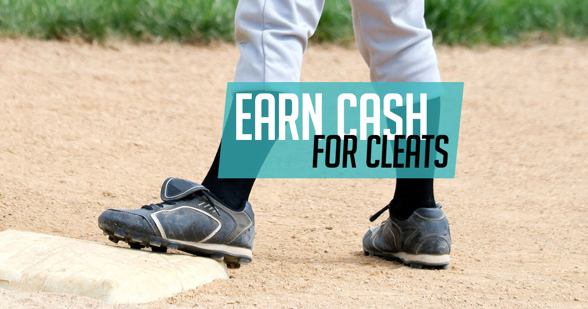 two legs from the knee down on a baseball field. left foot is on base