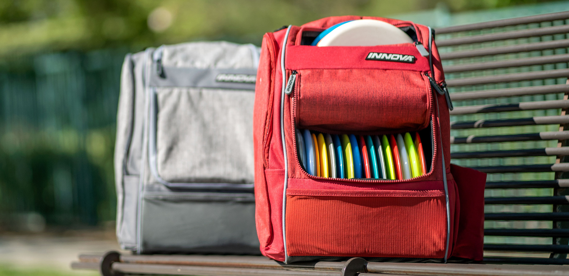 Close-up of an Innova disc golf driver with trade-in promotion