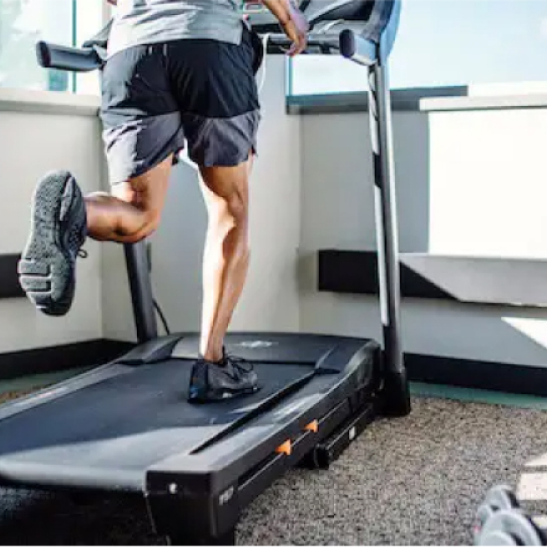 Man running on a treadmill