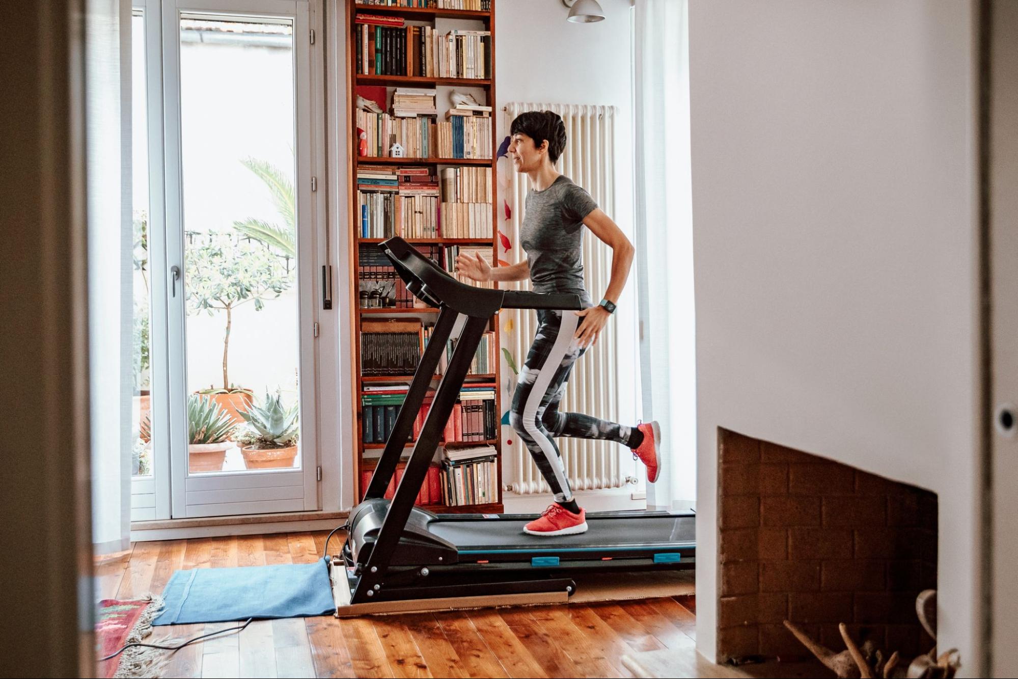 lady running on a treadmill in her home delivered by Play it Again in Soquel.