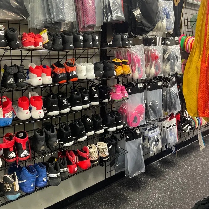 Wall of wrestling shoes and gear at Play It Again Sports Warren Township