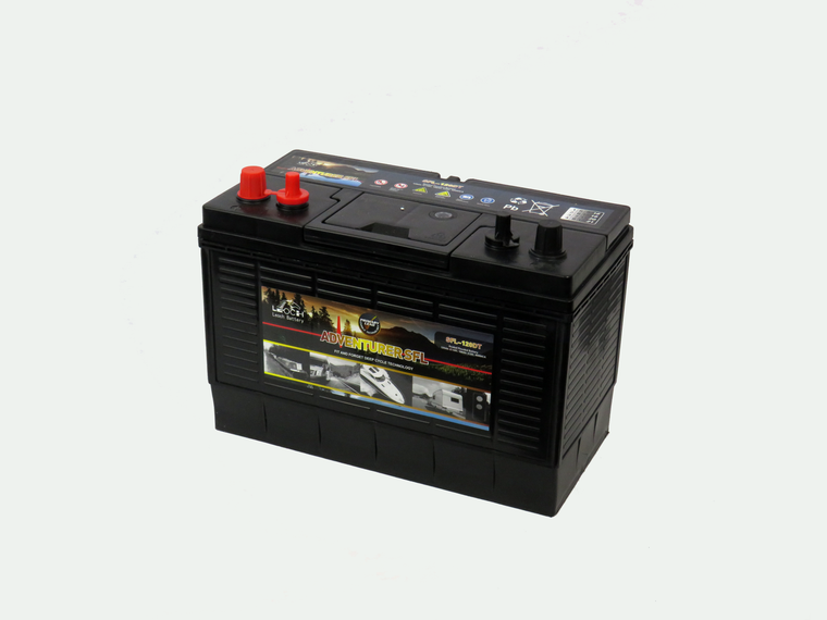 Angled view of a Leoch SFL-120DT leisure battery. Black all over except for the Red positive terminals located on the top left edge. On the front we can see a label showing the key details such as voltage and amperage.