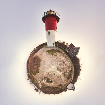 A 360-degree panoramic spherescape of Nauset Light in Cape Cod, featuring the red and white lighthouse against a muted pastel sky. The landscape is earthy and barren, enhancing the lighthouse's prominence.
Captivating Coastal Charm
Experience the captivating charm of Nauset Light with this exquisite fine art dye sublimation print. Whether you opt for the sleek metal finish or the classic paper version, this artwork beautifully captures the iconic lighthouse set against the serene Cape Cod landscape. The striking red and white structure stands proudly amidst earthy tones and a tranquil evening sky, bringing a touch of coastal elegance to any space.

A Symbol of Guidance and Resilience
Nauset Light, with its bold colors and solitary presence, serves as a powerful symbol of guidance and resilience. This print not only enhances your decor but also inspires a sense of calm and reflection. The harmonious blend of earthy and pastel tones creates a soothing atmosphere, making it perfect for spaces dedicated to relaxation and contemplation, such as living rooms, offices, or meditation areas.

Ideal for Coastal Enthusiasts
Looking for a unique gift for a coastal enthusiast or art lover? The Nauset Light print is an exceptional choice. Crafted using high-quality dye sublimation, this print ensures long-lasting vibrancy and durability. Its timeless appeal and tranquil beauty make it a cherished piece that recipients will treasure for years to come, adding a touch of Cape Cod's historic charm to their home.