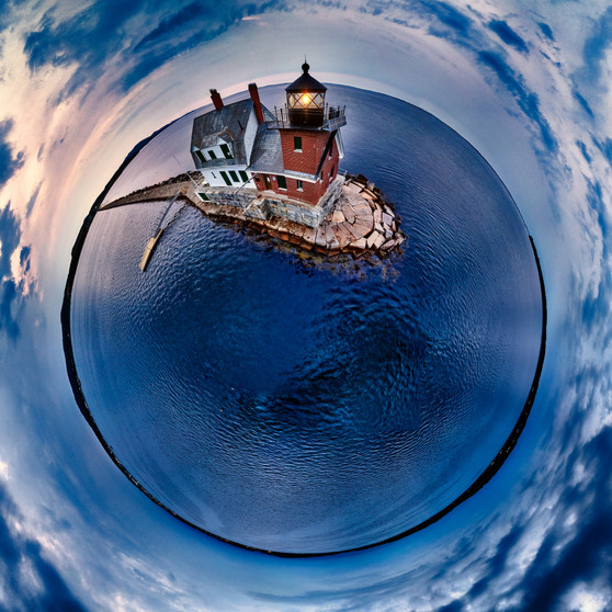 A tranquil blue hour envelopes the Rockland Breakwater Lighthouse in Maine, presented in a spherical panorama that accentuates the harmony between sea, sky, and the solitary lighthouse