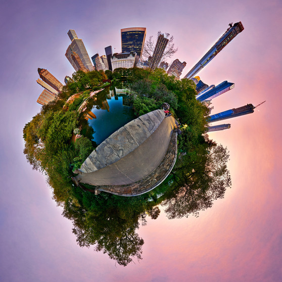 A 360-degree panoramic spherescape capturing the essence of Central Park at sunset with Gapstow Bridge and the 59th Street Pond framed by the warm hues of the cityscape.