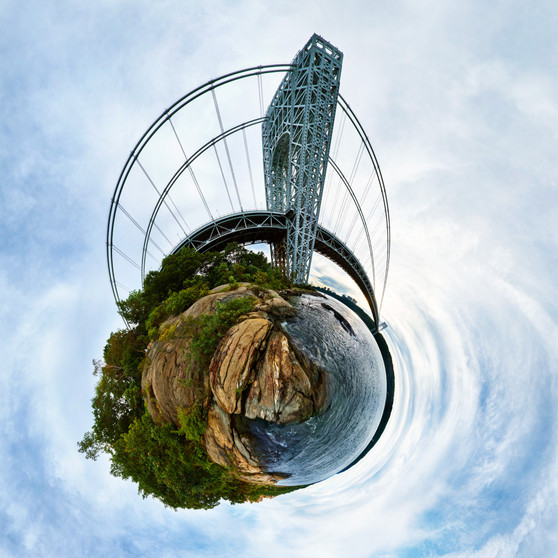 A 360-degree panoramic Spherescape of the George Washington Bridge, with its towering structure over the Hudson River, surrounded by cliffs and trees in a harmonious natural and architectural blend.