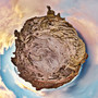 Late afternoon 360-degree panoramic view of Hell's Half Acre in Wyoming depicted as a Spherescape with prominent red rock formations and a vivid sky.