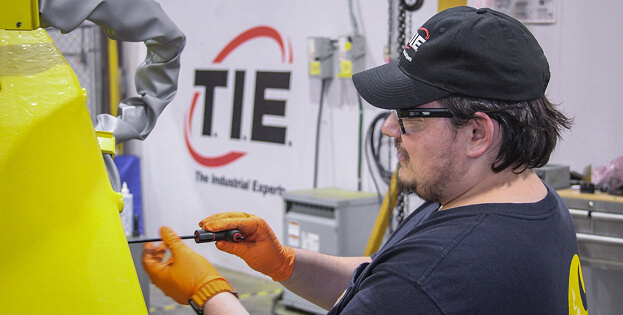 T.I.E. Industrial engineer performing repairs