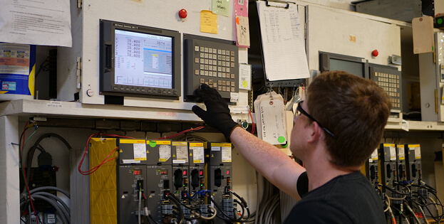 T.I.E. Industrial technician performing Fanuc comprehensive testing