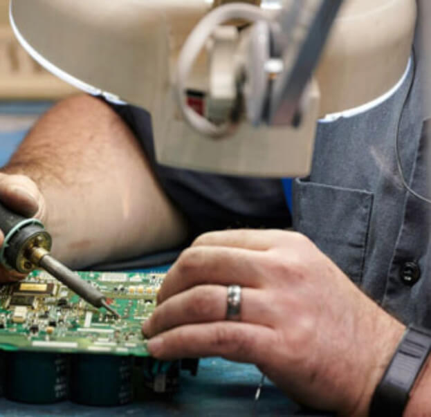 T.I.E. Industrial engineer using soldering iron
