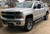 Silver Chevy Silverado 2500HD with American Truxx Grind Chrome Rims