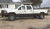 White GMC 3500 with Chrome American Truxx Armor Rims