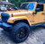 Yellow Jeep Wrangler with American Truxx Ninja Rims
